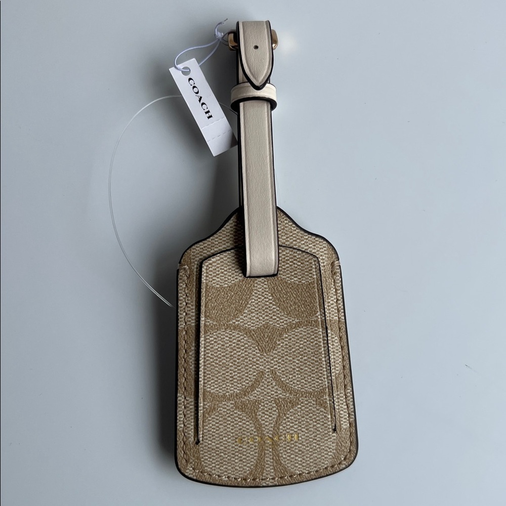 Coach Tan Luggage Tag with gold hardware in signature canvas